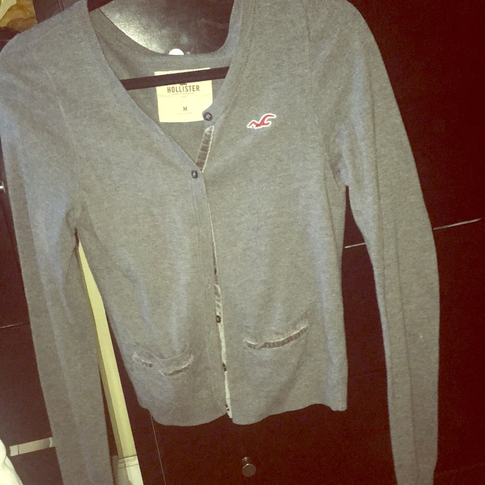 Grey button up cardigan.